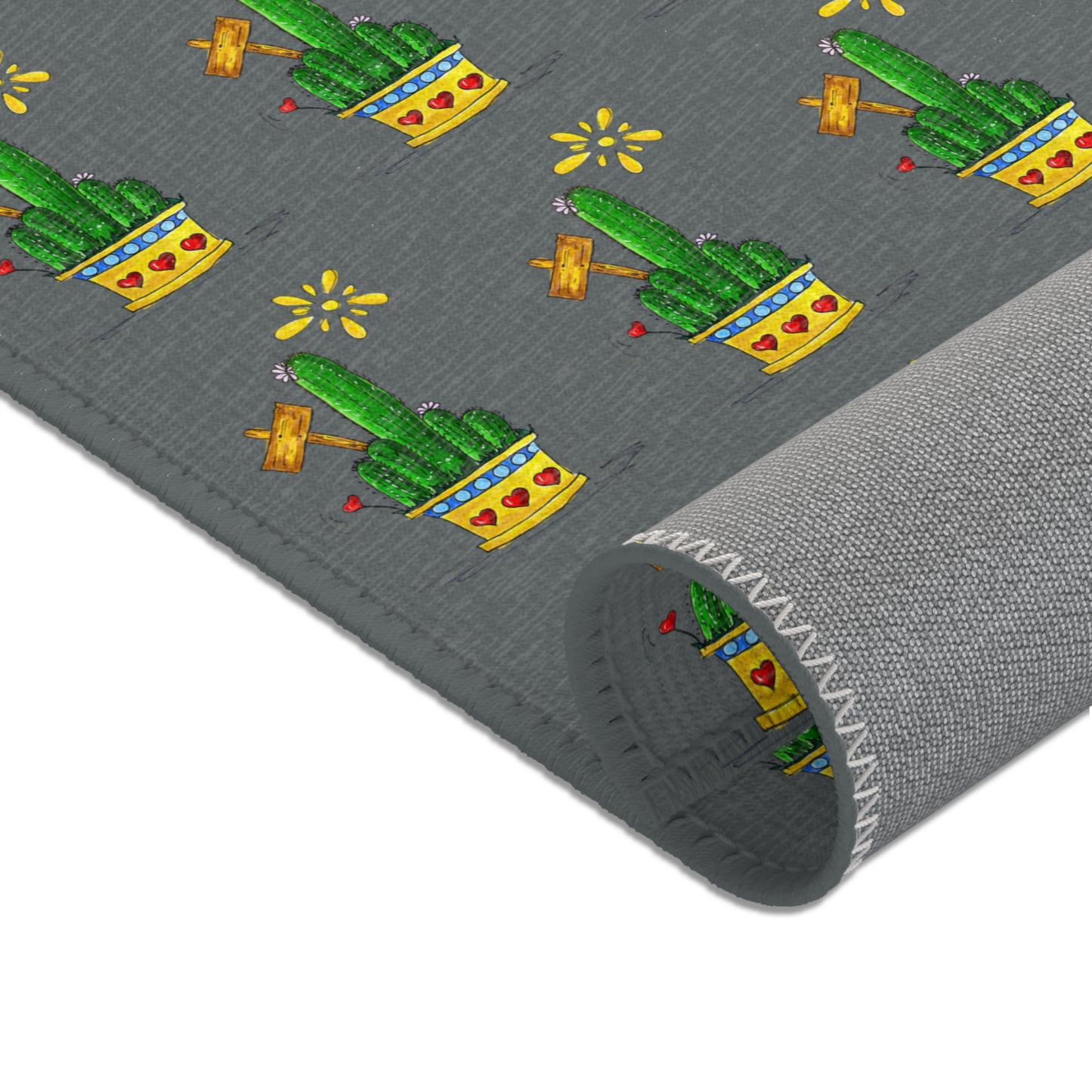 small grey area rug with cactus drawings