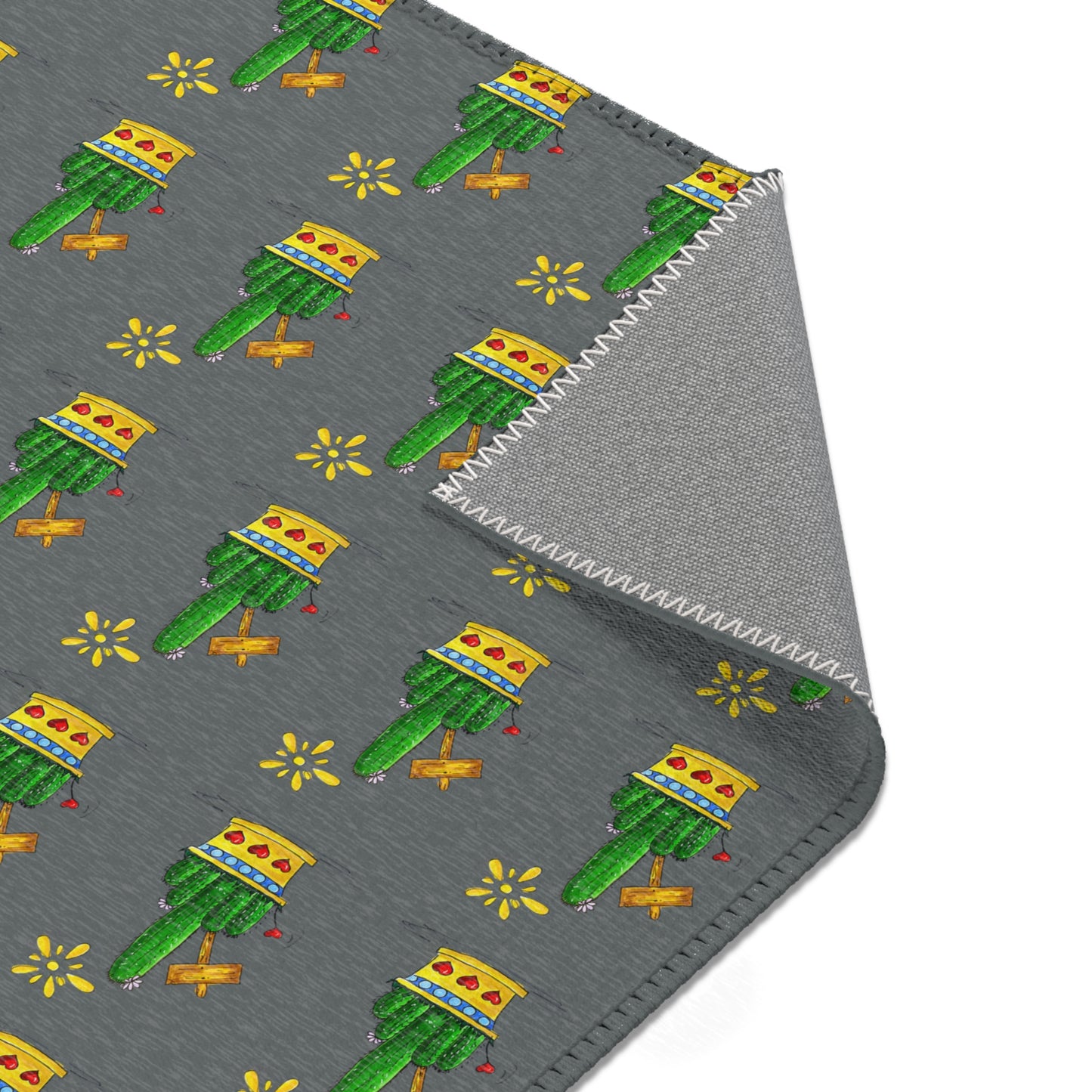 small grey area rug with cactus drawings