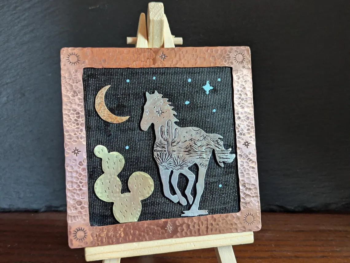 Mixed metal art piece with a running horse and a prickly pear cactus