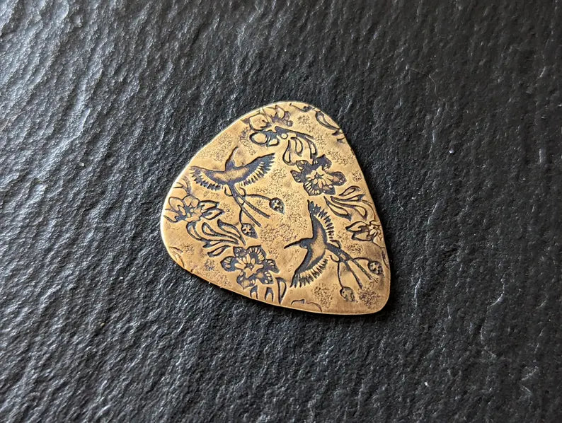Bronze guitar pick - playable with birds of paradise pattern