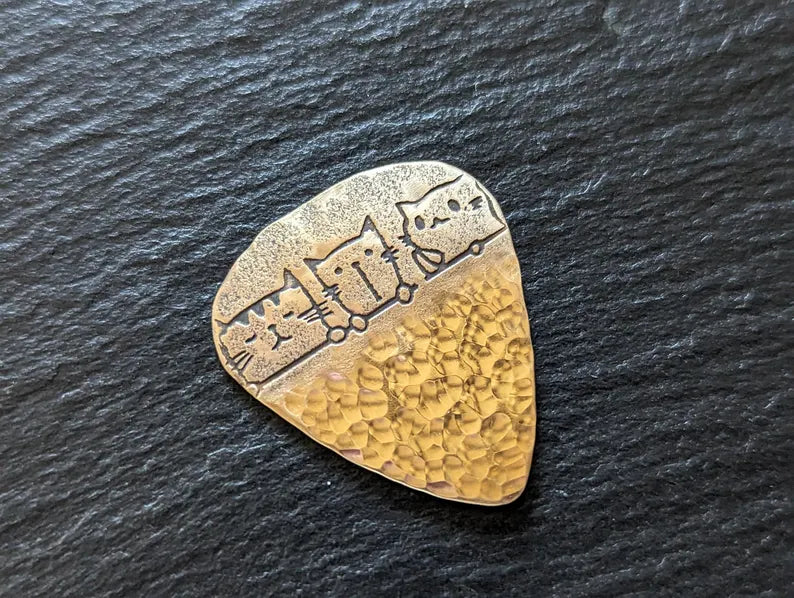 Bronze guitar pick with cats and a hammered bottom - handmade and playable