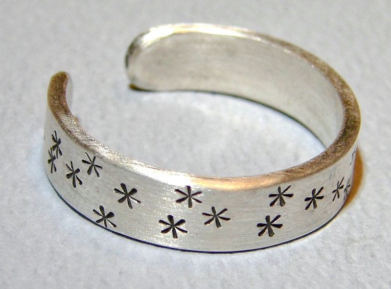Adjustable star stamped sterling silver ring