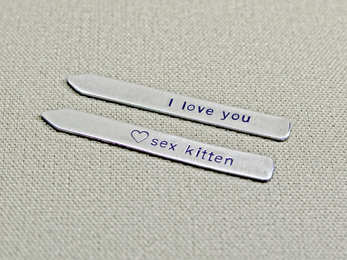 Aluminum collar stays stamped with sex kitten