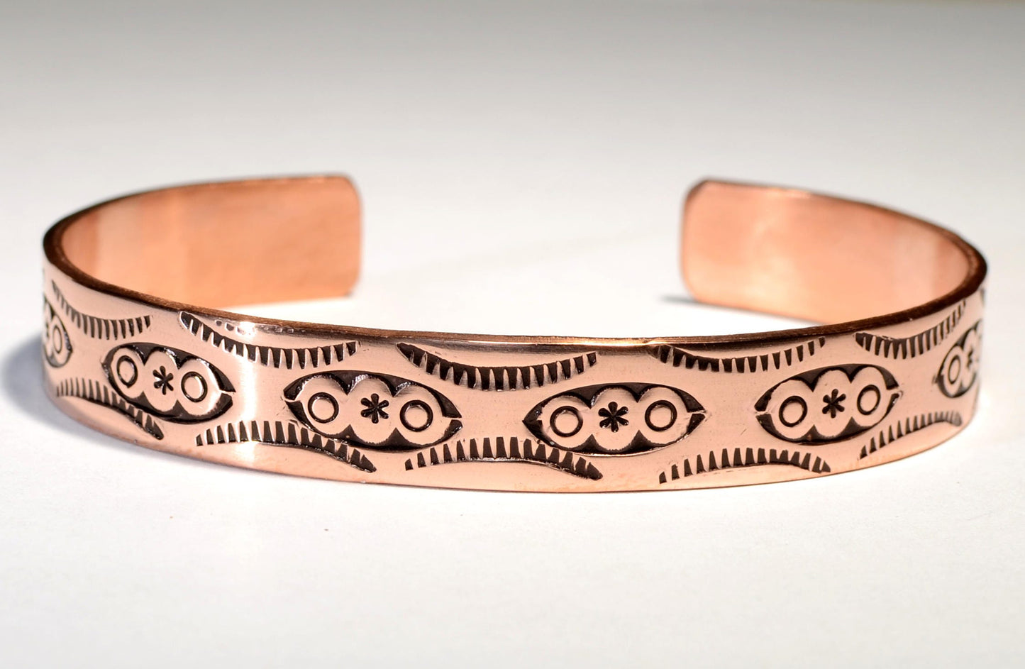 Copper cuff bracelet imprinted with Native American Handmade Metal Stamps