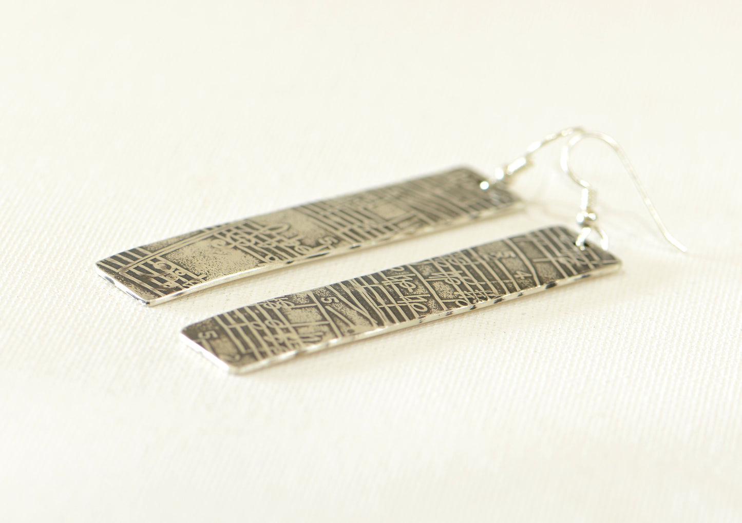 Musical Sterling Silver Earrings with Melodic Inspiration scrolled out on Antiqued Sheet Music Design