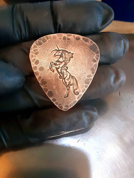 Unicorn and hammered edges copper guitar pick