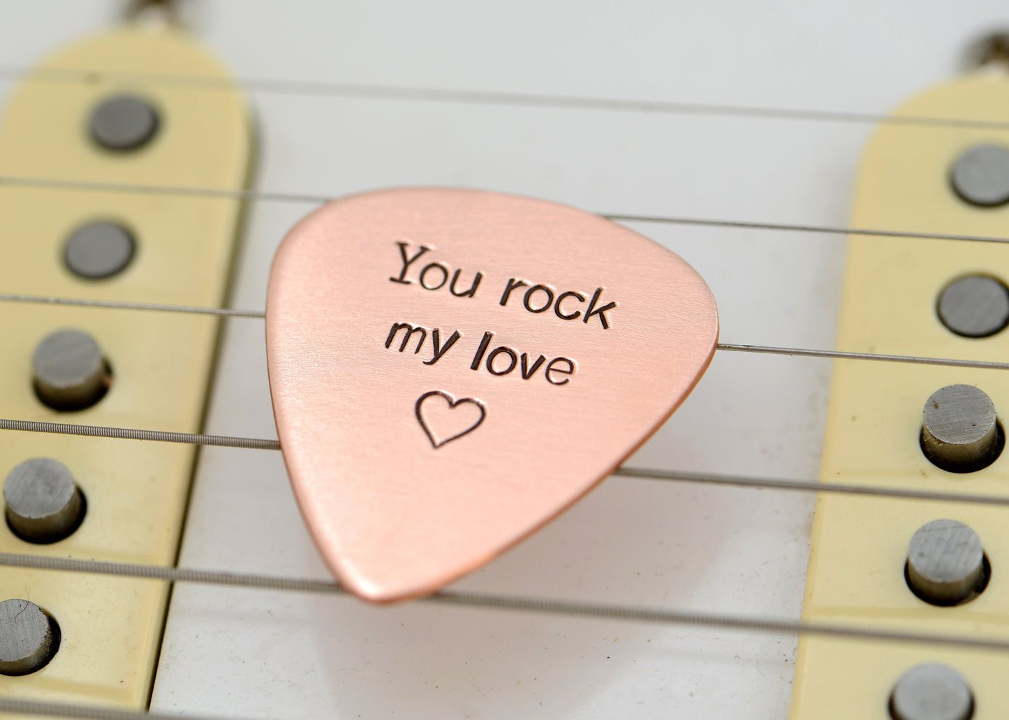 You rock my love guitar pick in copper