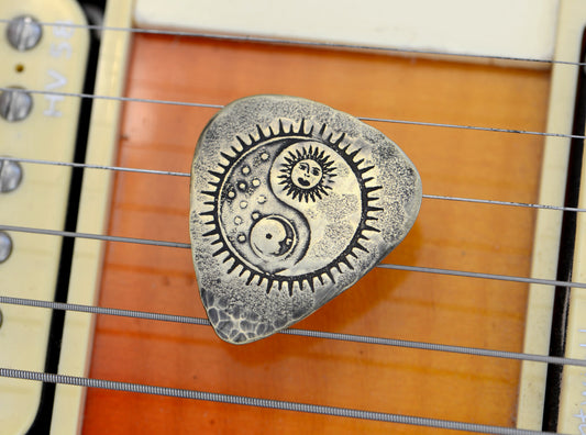 Yin Yang Sun and Moon on a Bronze Guitar Pick
