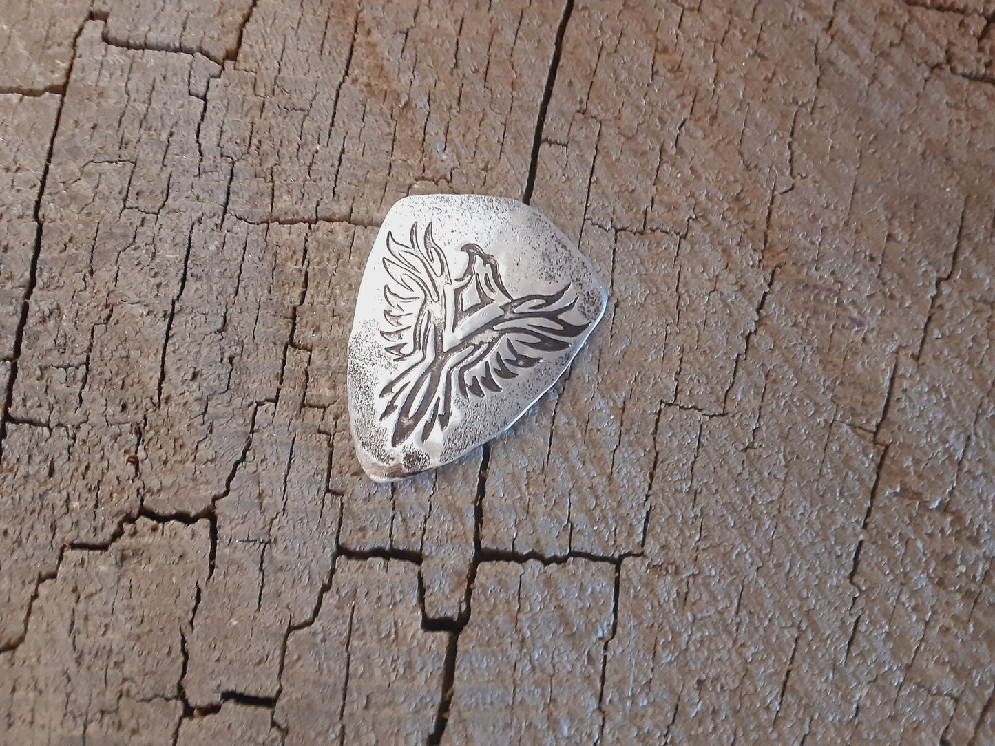 Aluminum guitar pick with Phoenix design