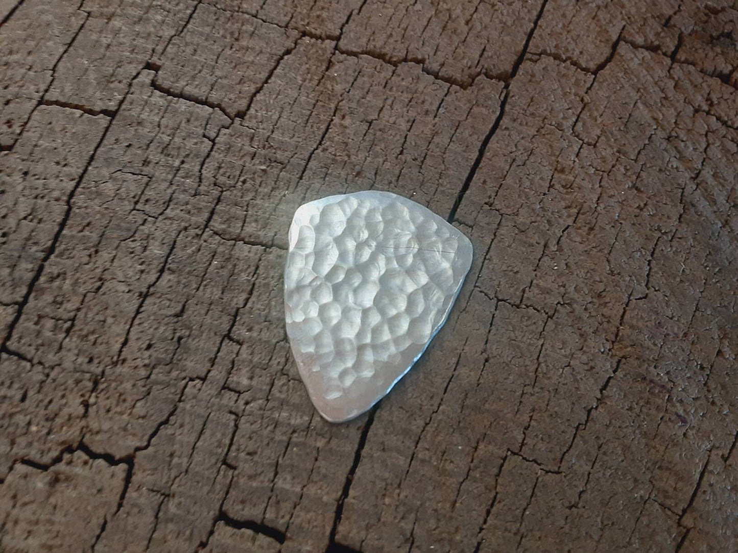Aluminum shield shaped guitar pick playable with norse crow symbol