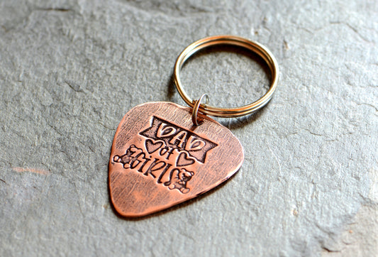 Copper guitar pick keychain stamped with dad of girls
