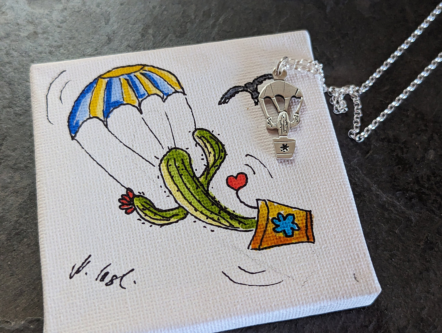tiny silver parachuting cactus and mini drawing of cactus on parachute on stretched canvas ( Original art )