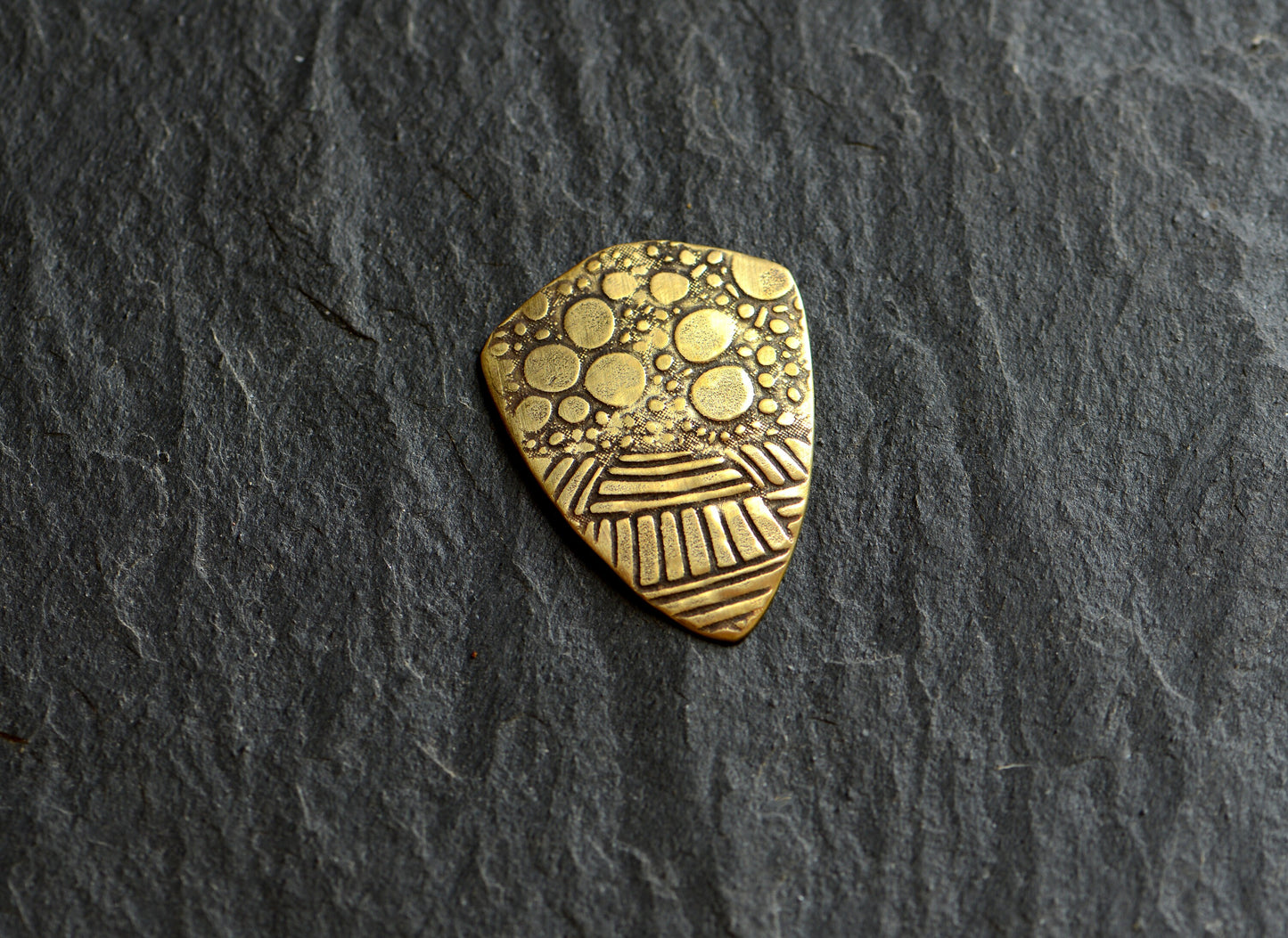 brass shield guitar pick - playable with crazy pattern