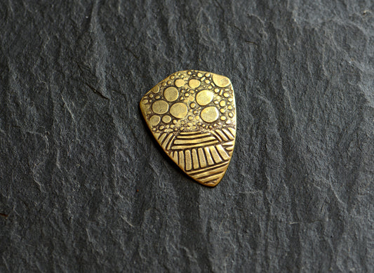 brass shield guitar pick - playable with crazy pattern
