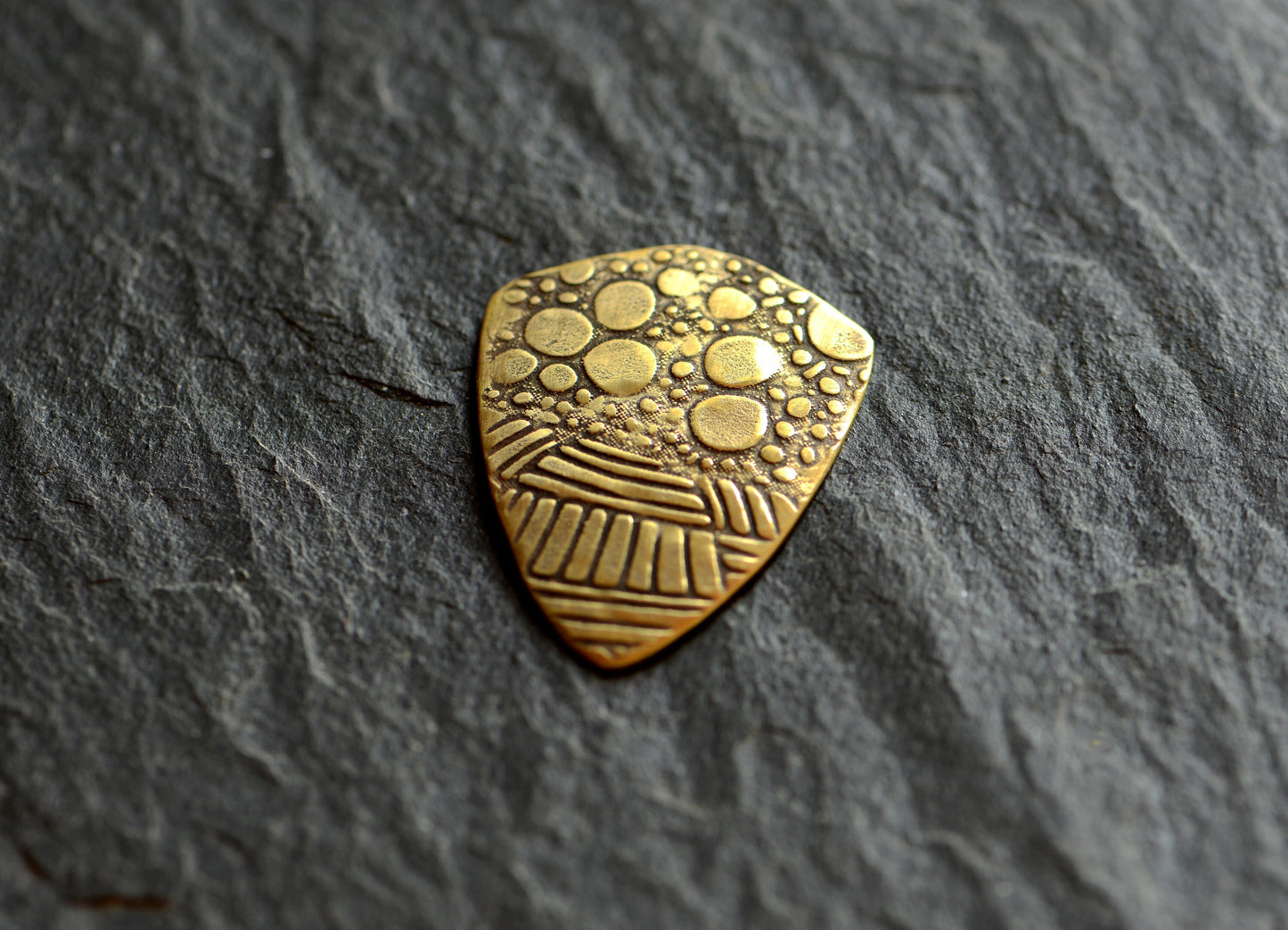 brass shield guitar pick - playable with crazy pattern