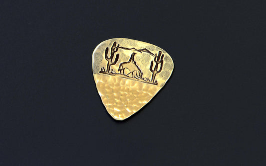 Bronze guitar pick with desert scene and cowboy - handmade and playable