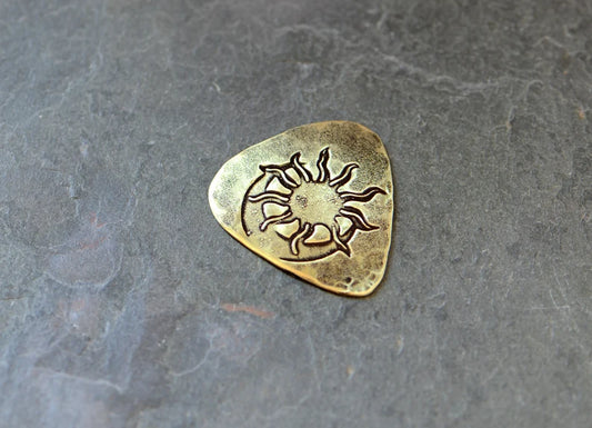 Brass guitar pick with sun and moon - handmade and playable