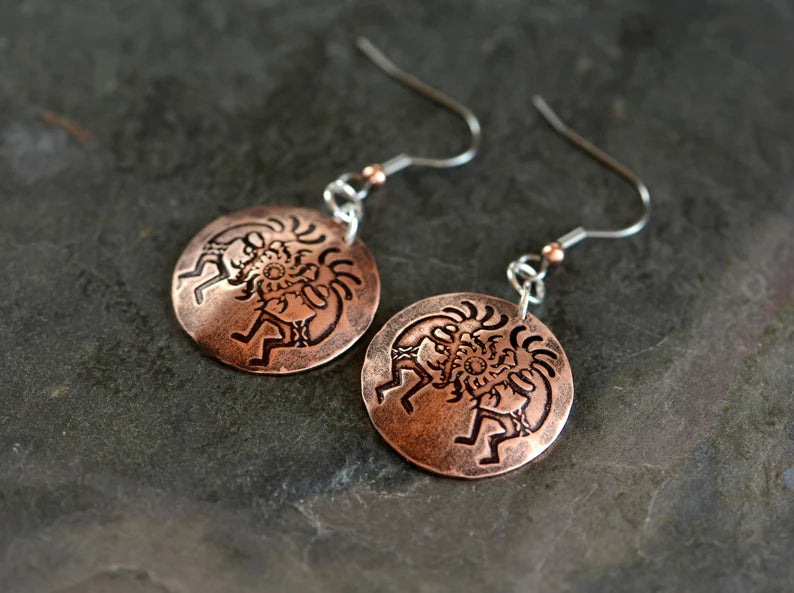 Copper dangle earrings with Kokopelli
