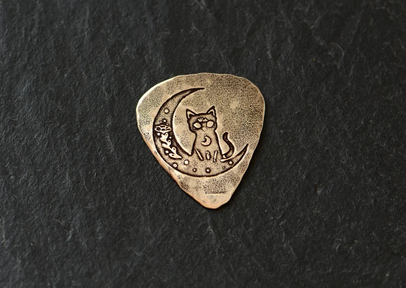 Bronze guitar pick with cat and moon - handmade and playable