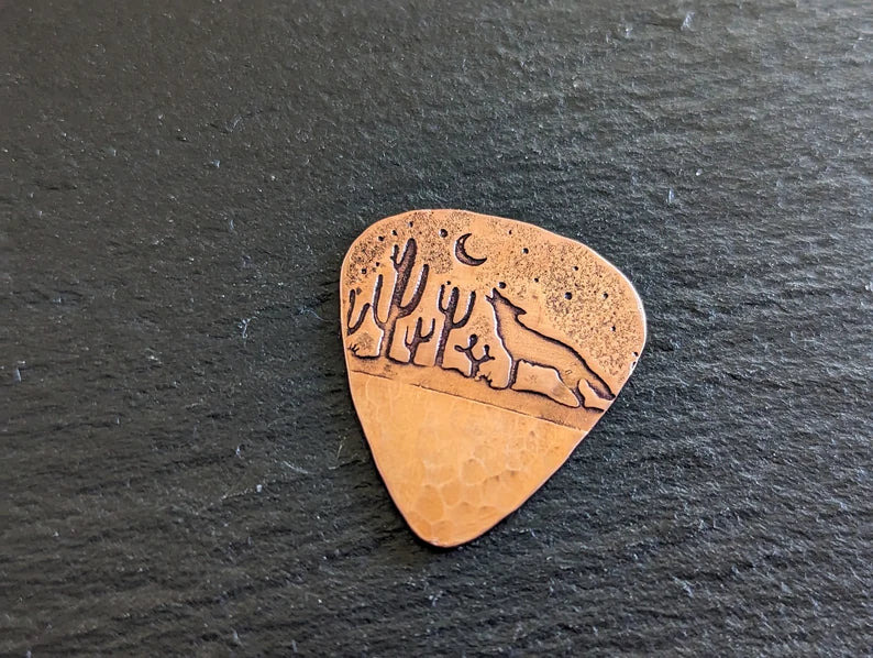 Copper guitar pick with howling coyote and cactus - handmade and playable