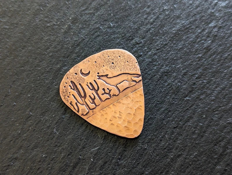 Copper guitar pick with howling coyote and cactus - handmade and playable