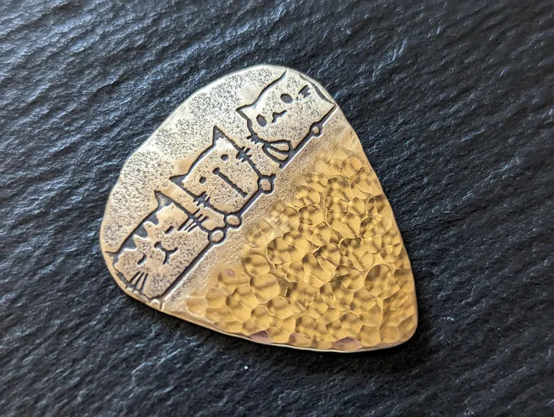 Bronze guitar pick with cats and a hammered bottom - handmade and playable