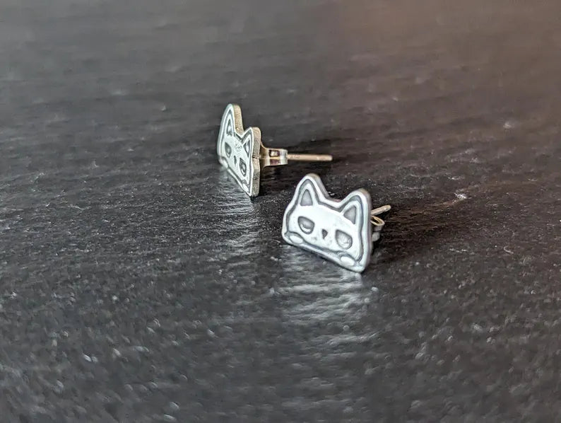 Tiny cats stud earrings made from sterling silver