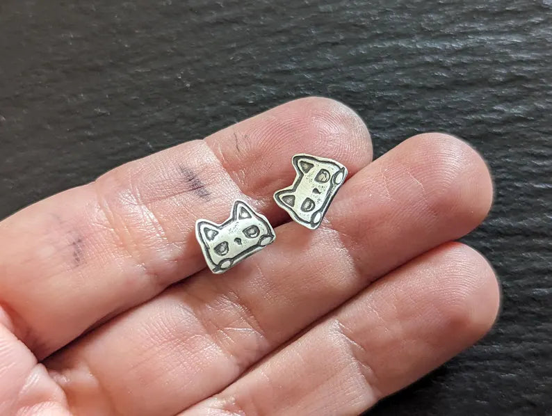 Tiny cats stud earrings made from sterling silver