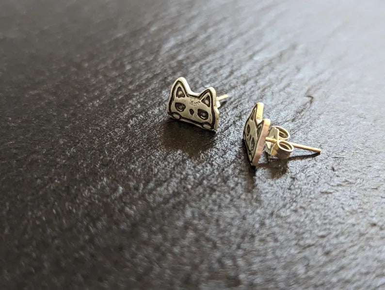 Tiny cats stud earrings made from sterling silver