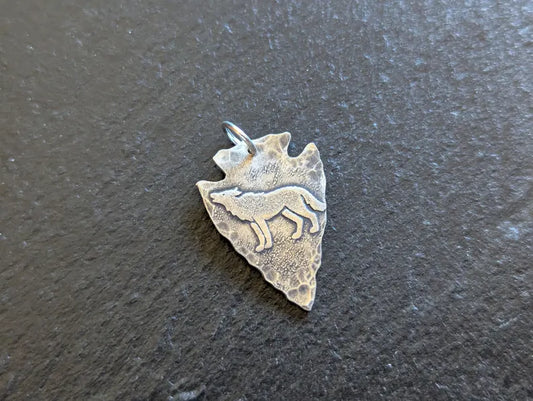 Small sterling silver arrowhead charm with wolf