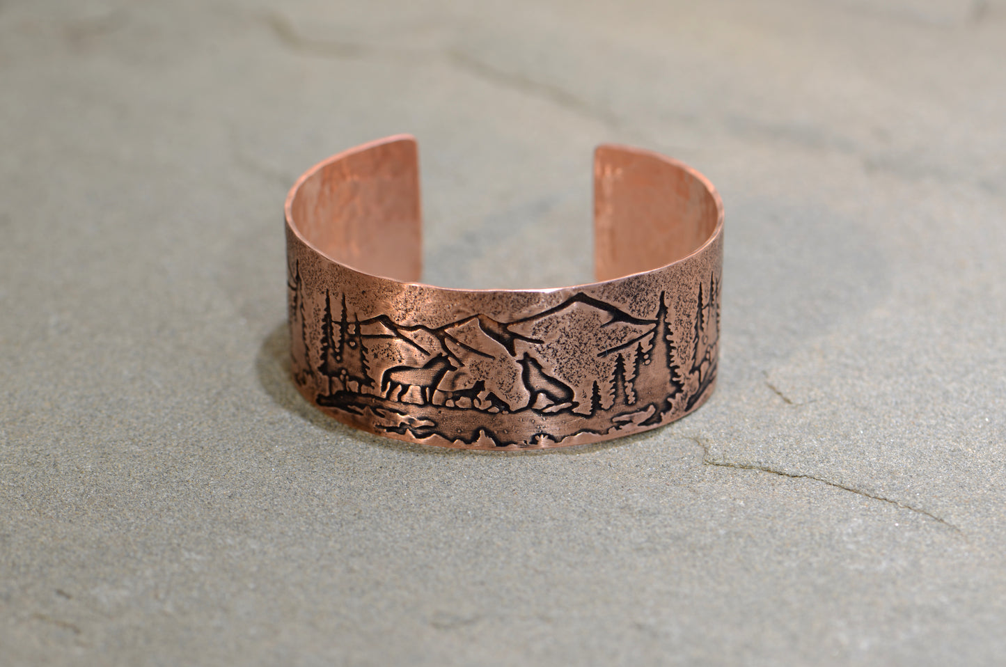 Copper bracelet with wolves