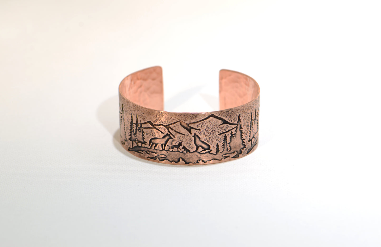 Copper bracelet with wolves