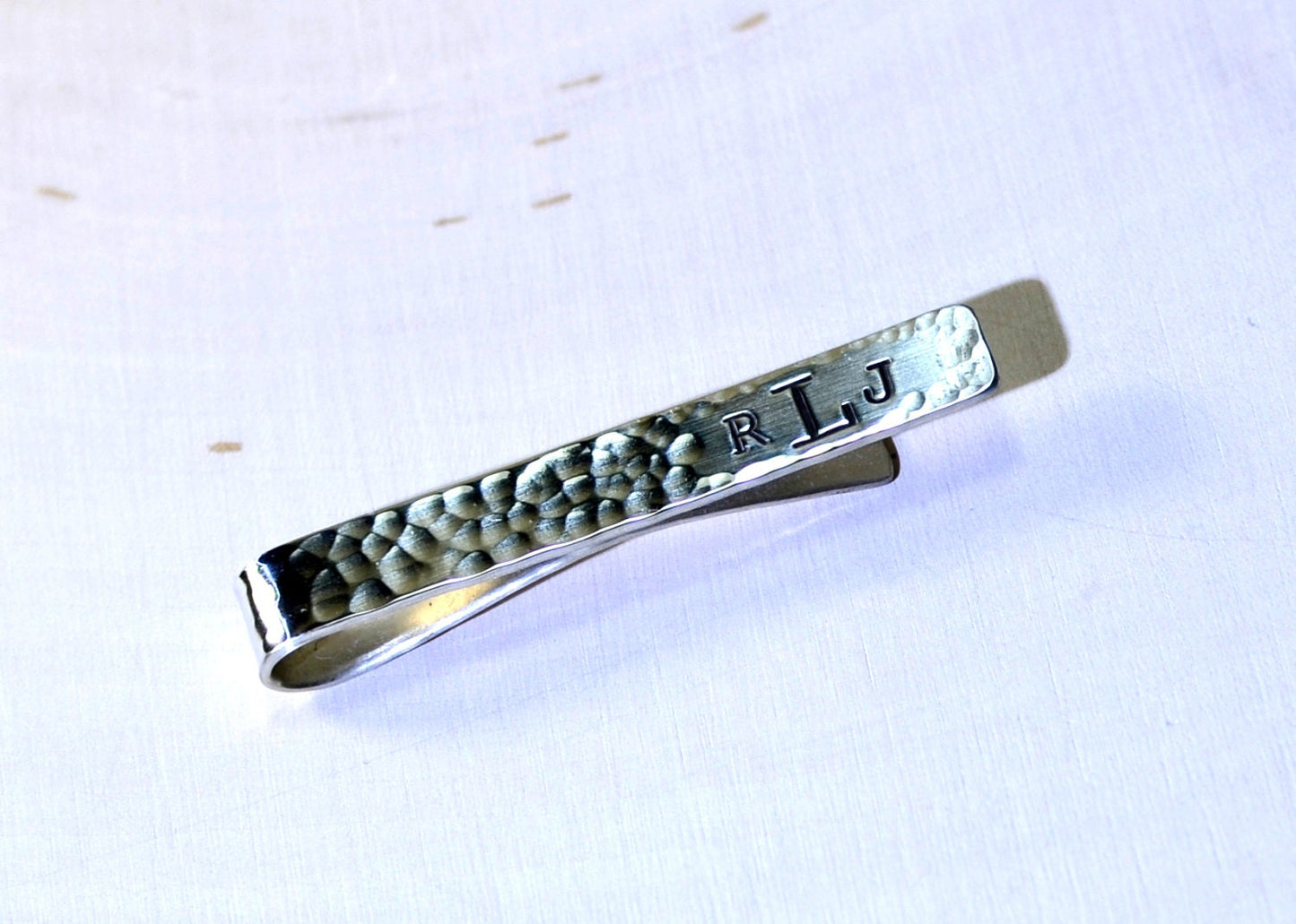 Hammered sterling silver tie clip with personalized monogram on tie bar