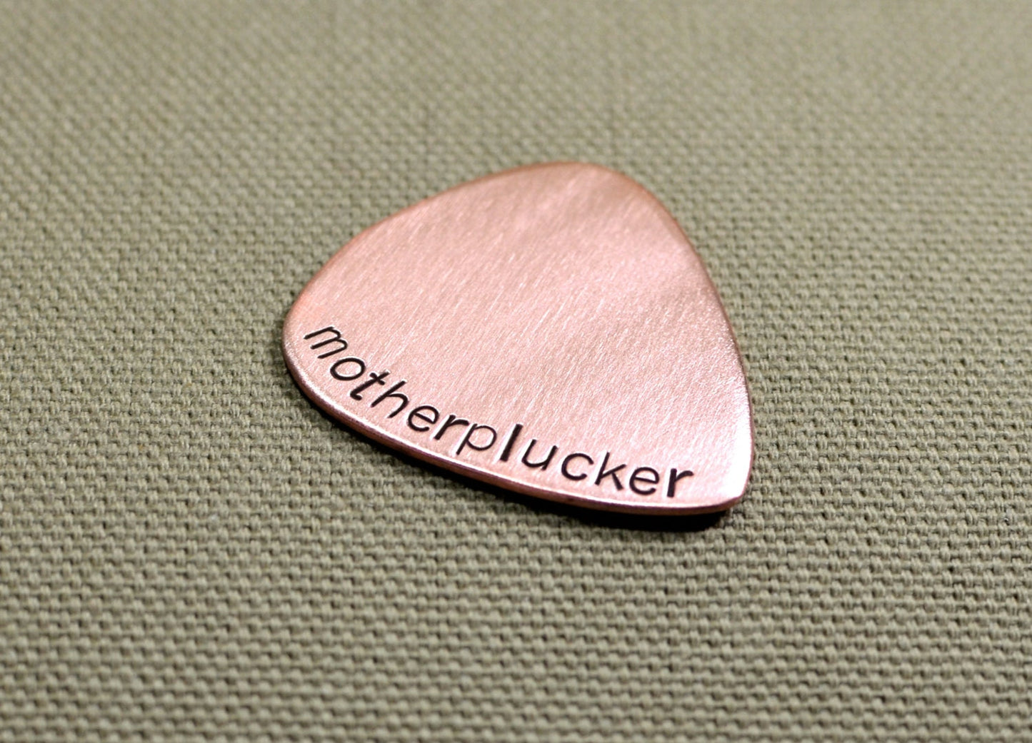 Motherplucker copper guitar pick
