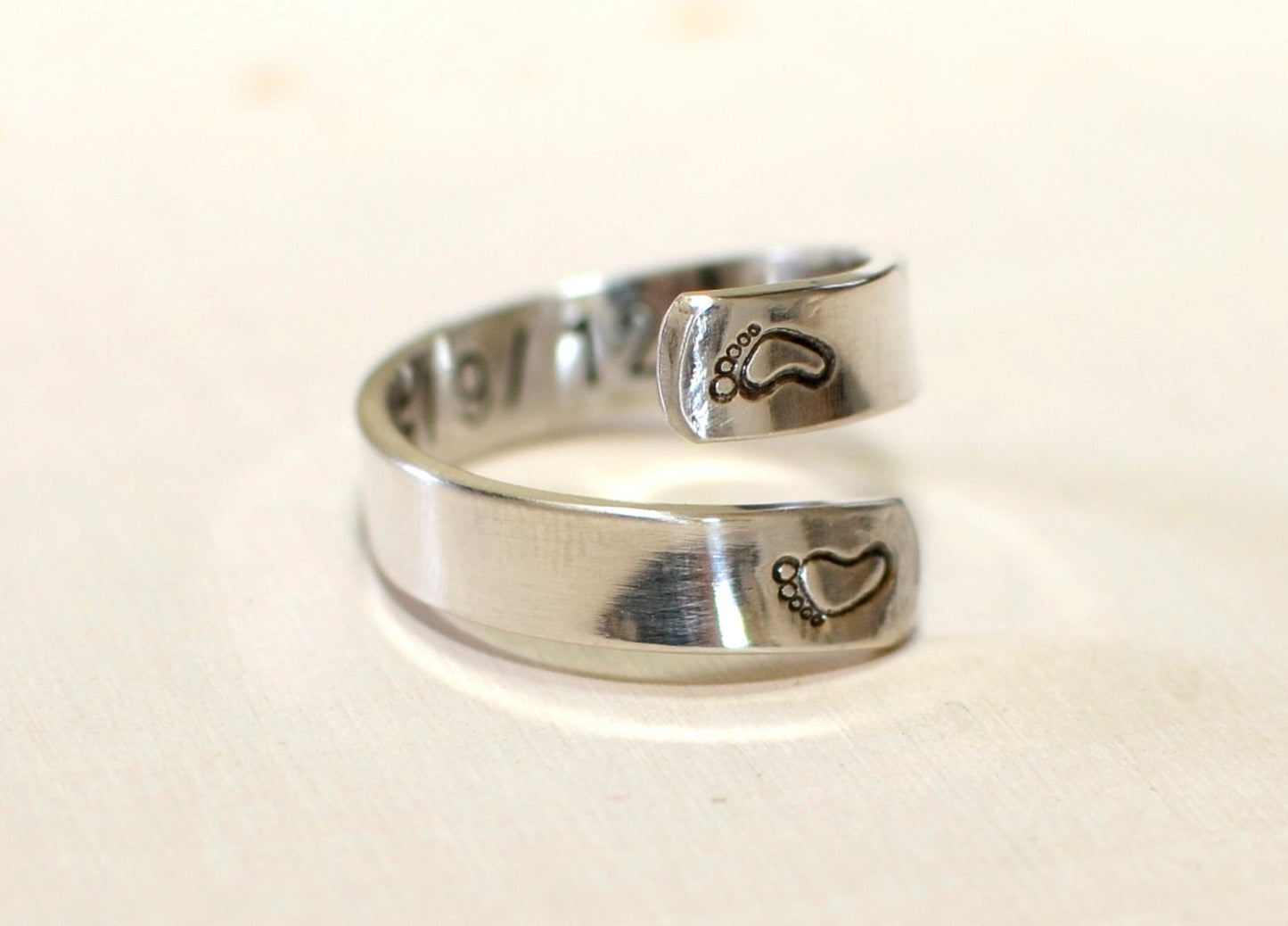 Sterling silver ring for a new mom with babyfeet and birth date