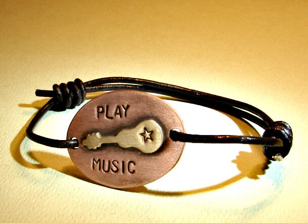 Guitar wrap bracelet with black leather cord