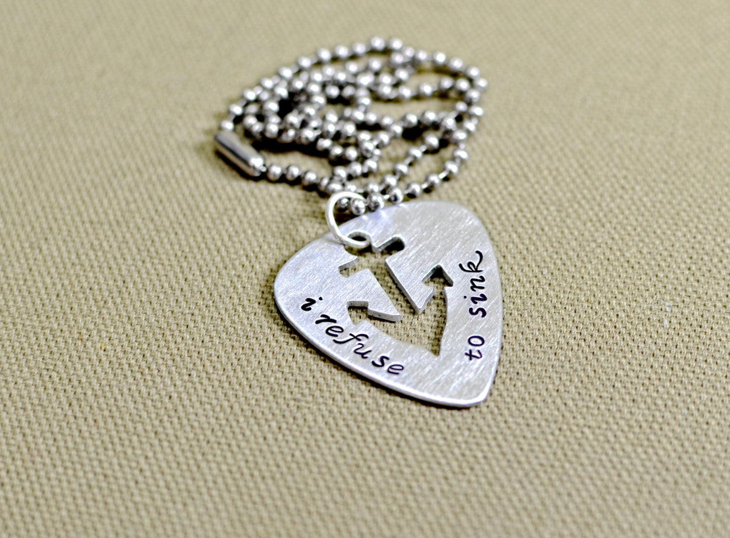Refuse to sink guitar pick necklace with anchor design