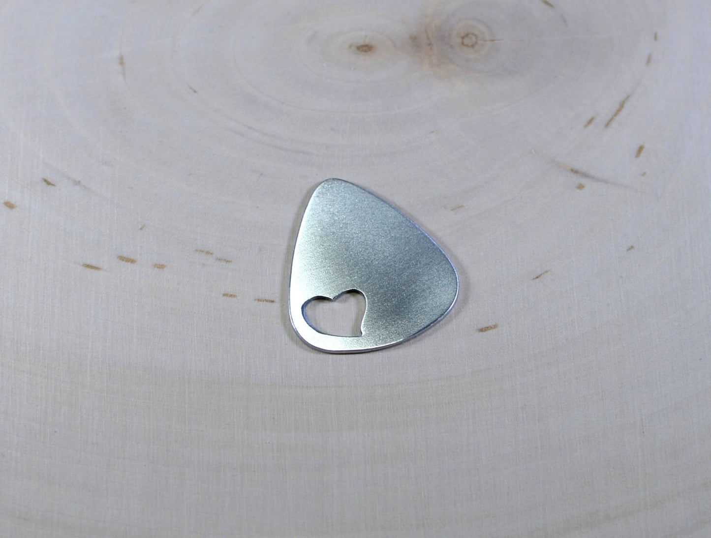 Love Guitar Pick with Cutout Heart in various metals