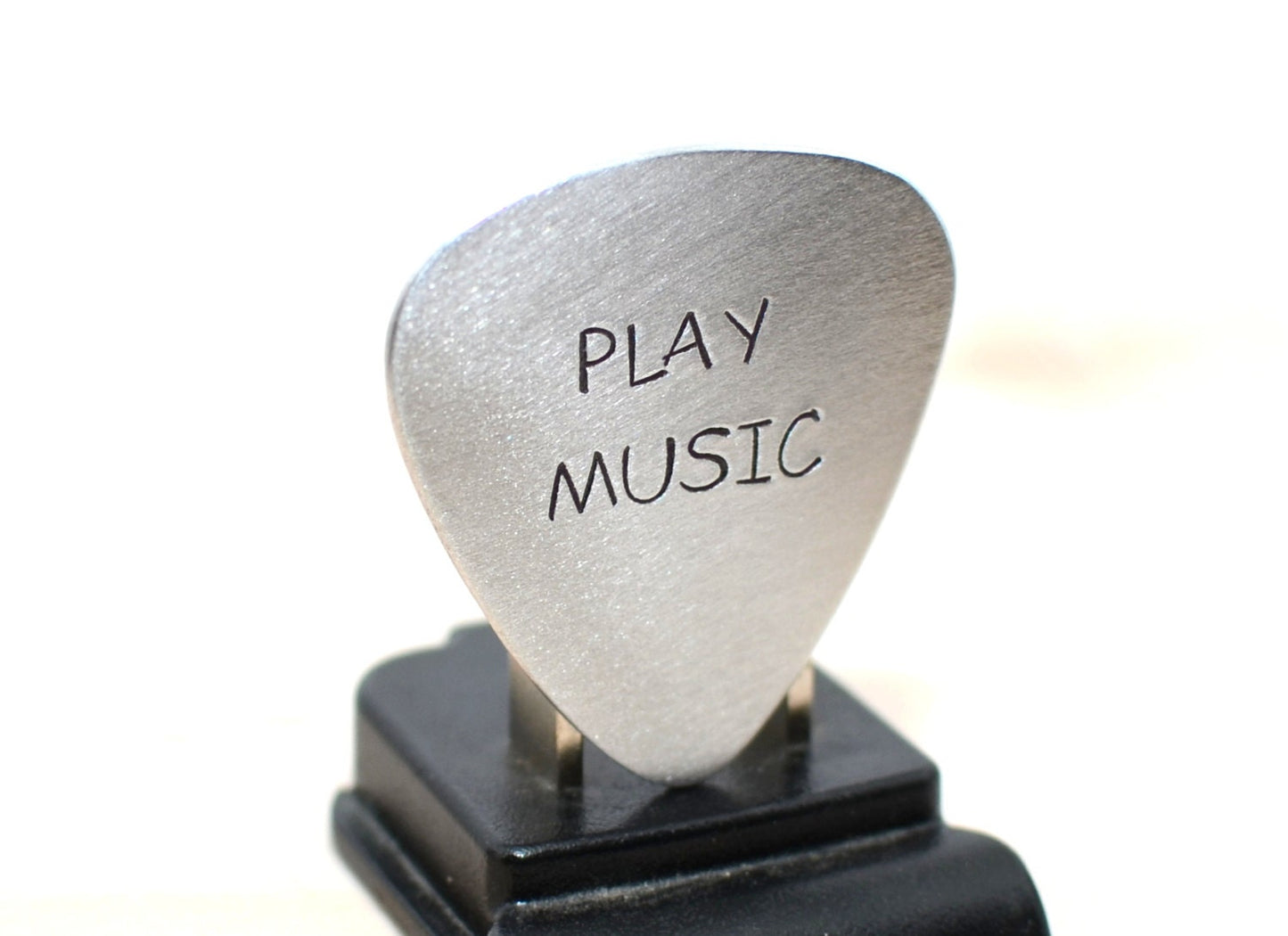 Play music guitar pick in your choice of metals