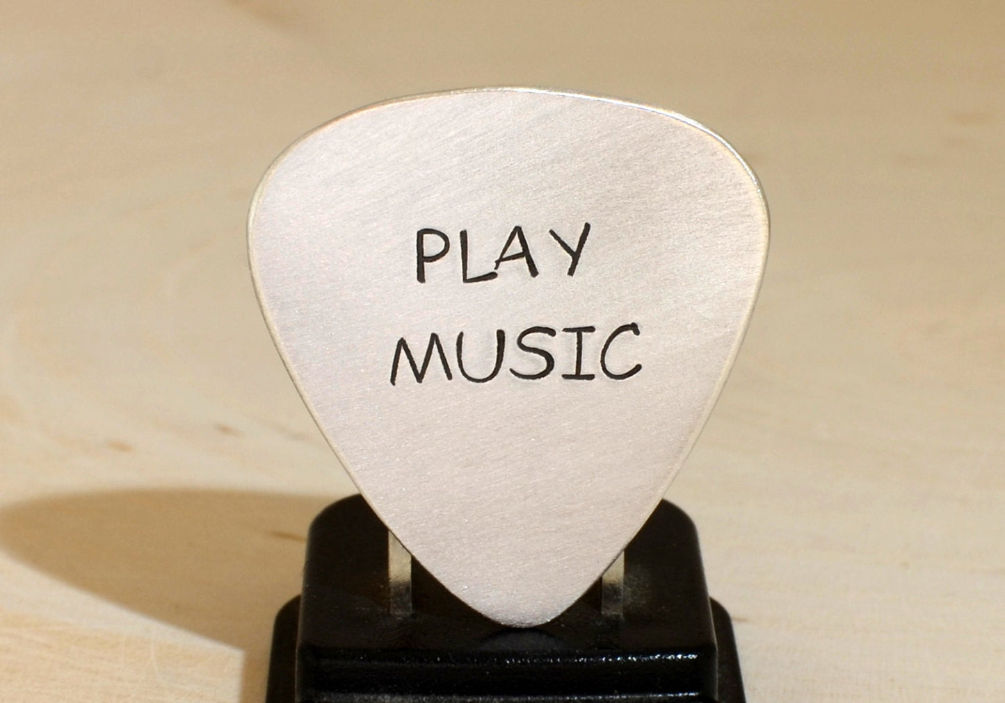 Play music guitar pick in your choice of metals