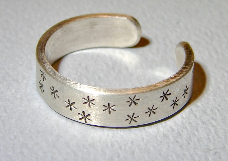 Adjustable star stamped sterling silver ring