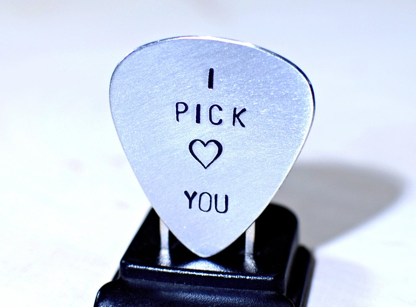 Aluminum I pick you guitar pick with a small heart design