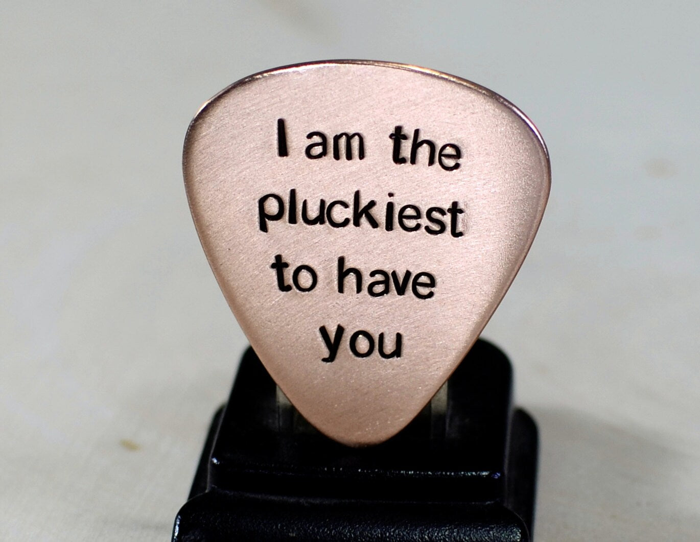 Copper guitar pick with I am the pluckiest to have you