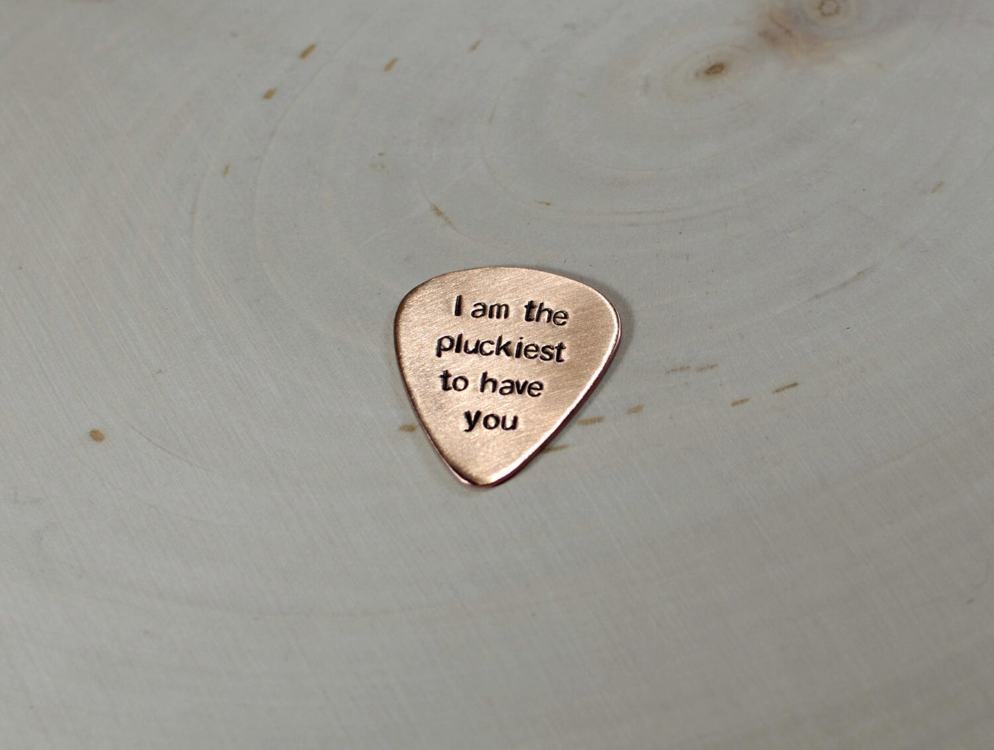 Copper guitar pick with I am the pluckiest to have you