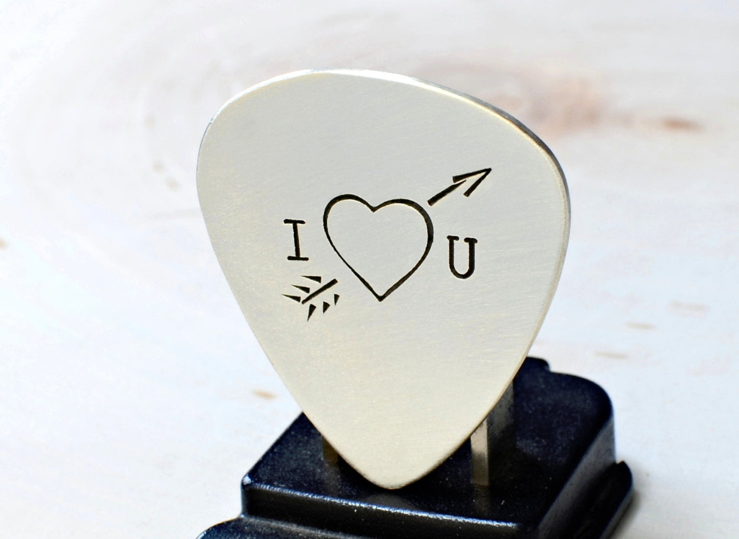 Heart and arrow theme on sterling silver guitar pick