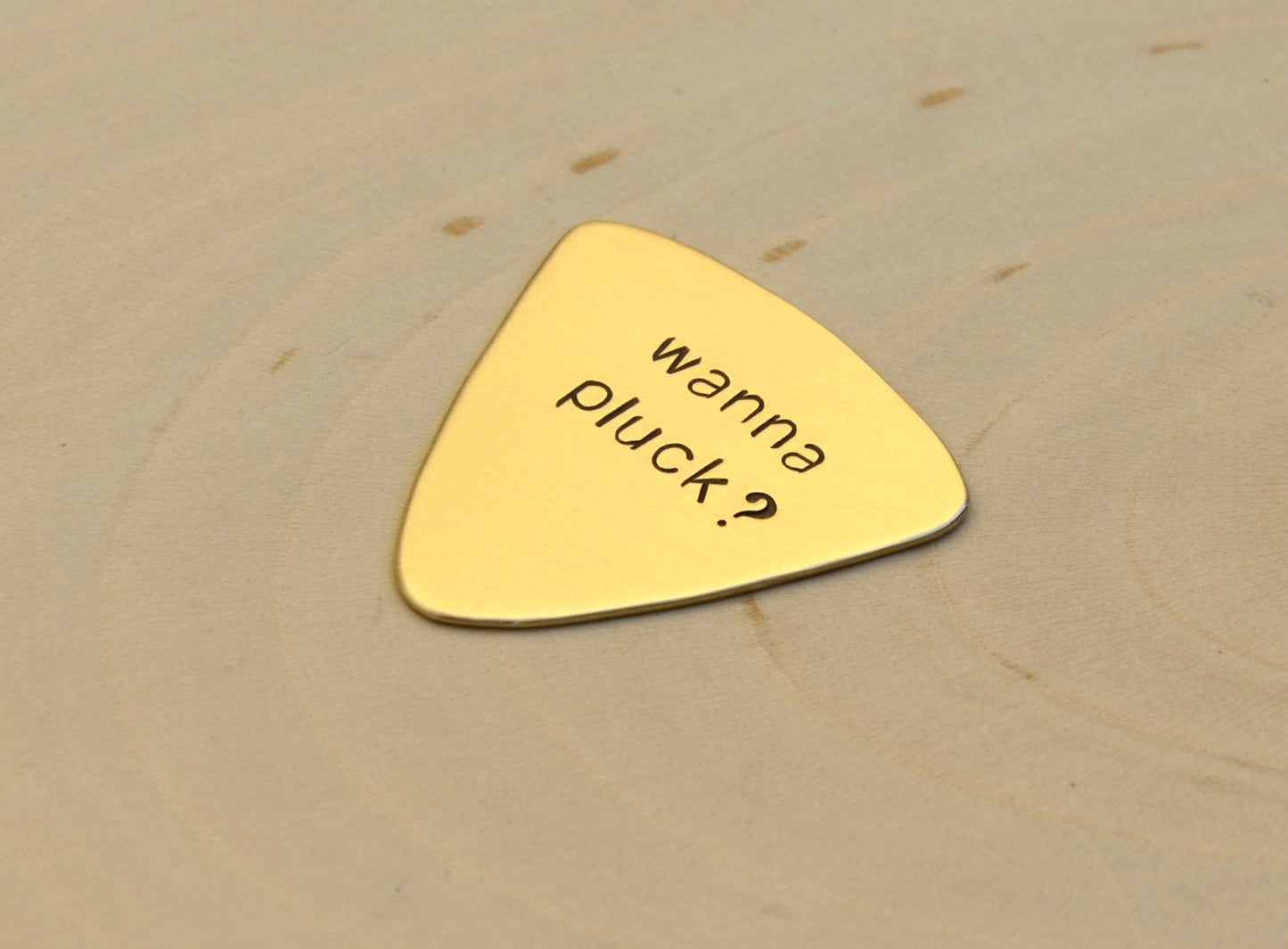 Wanna Pluck bronze triangular style guitar pick