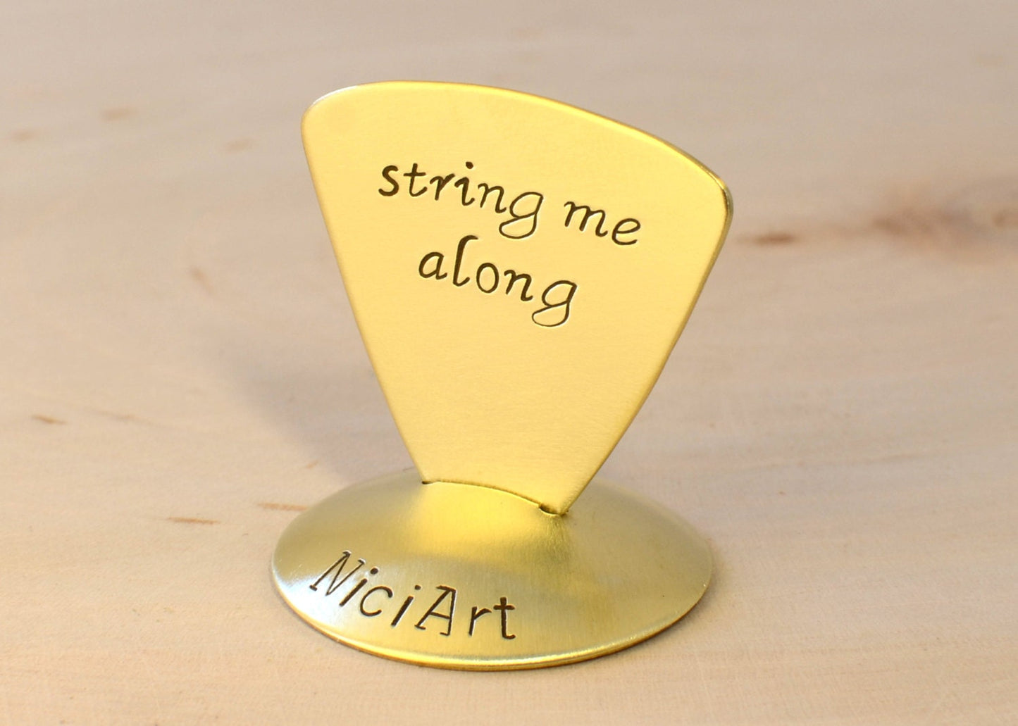 String me Along Triangular Style Guitar Pick in Brass