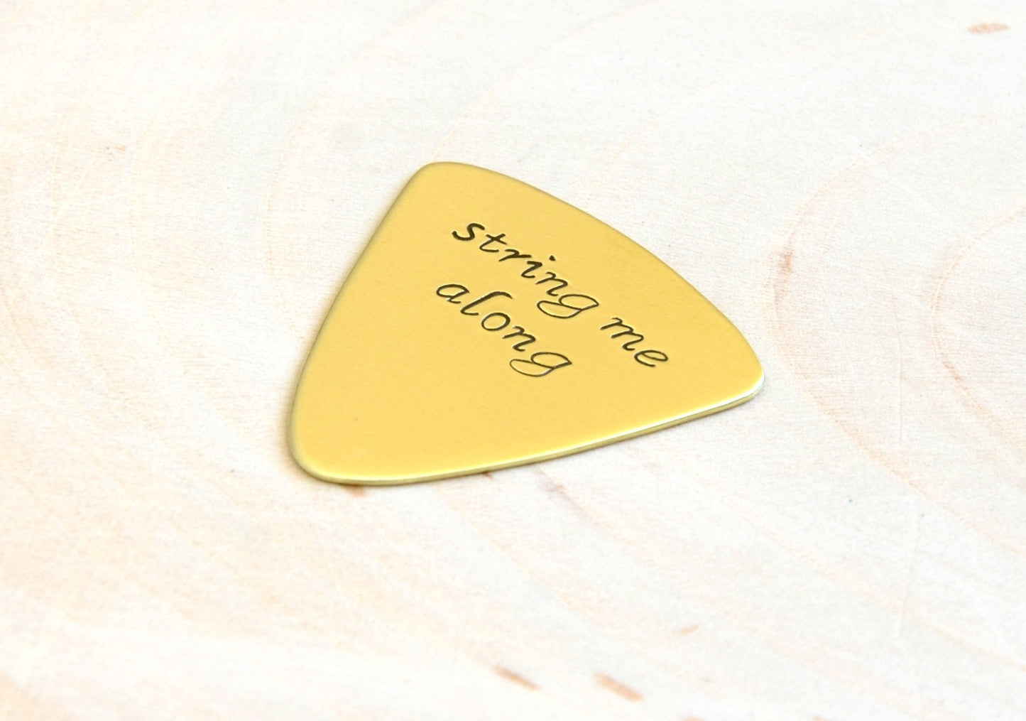 String me Along Triangular Style Guitar Pick in Brass