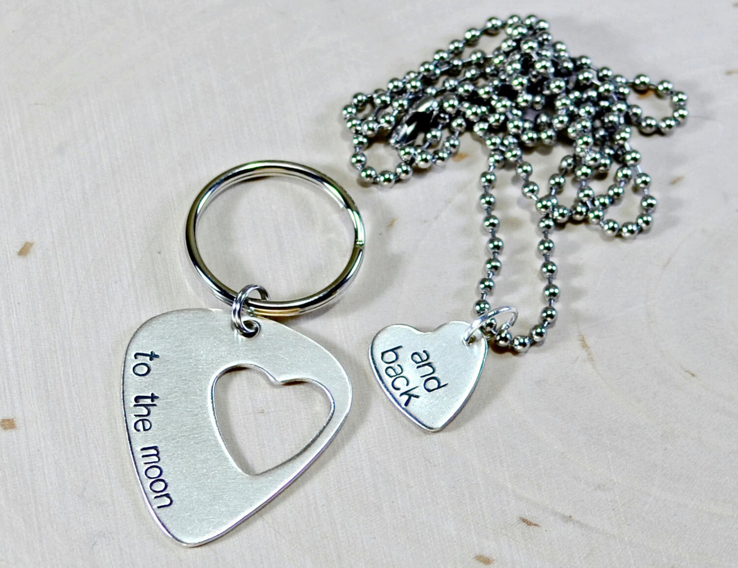 Couples sterling silver guitar pick keychain and necklace with love to the moon and back