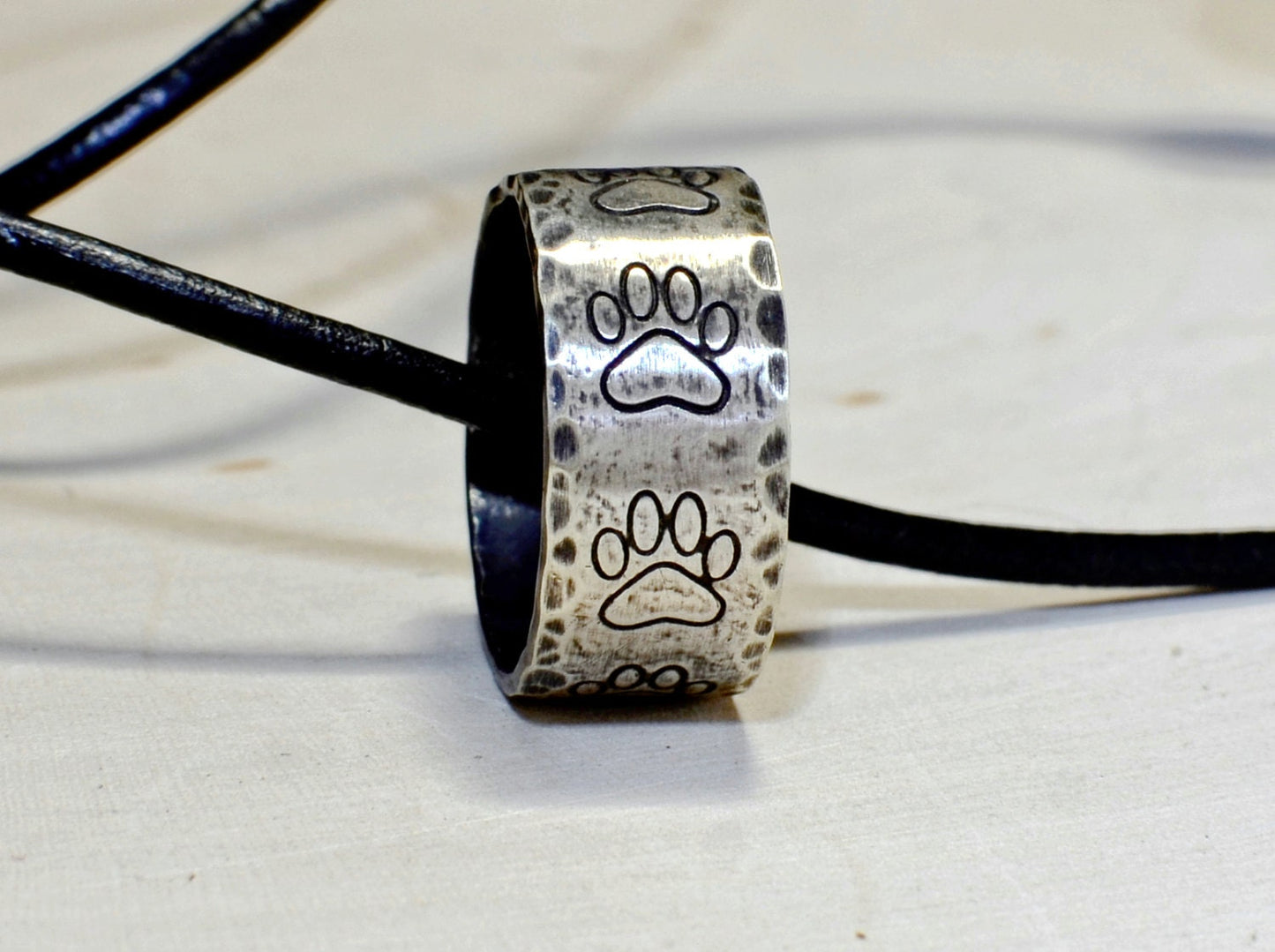 Hammered sterling silver paw ring necklace with rustic dark patina